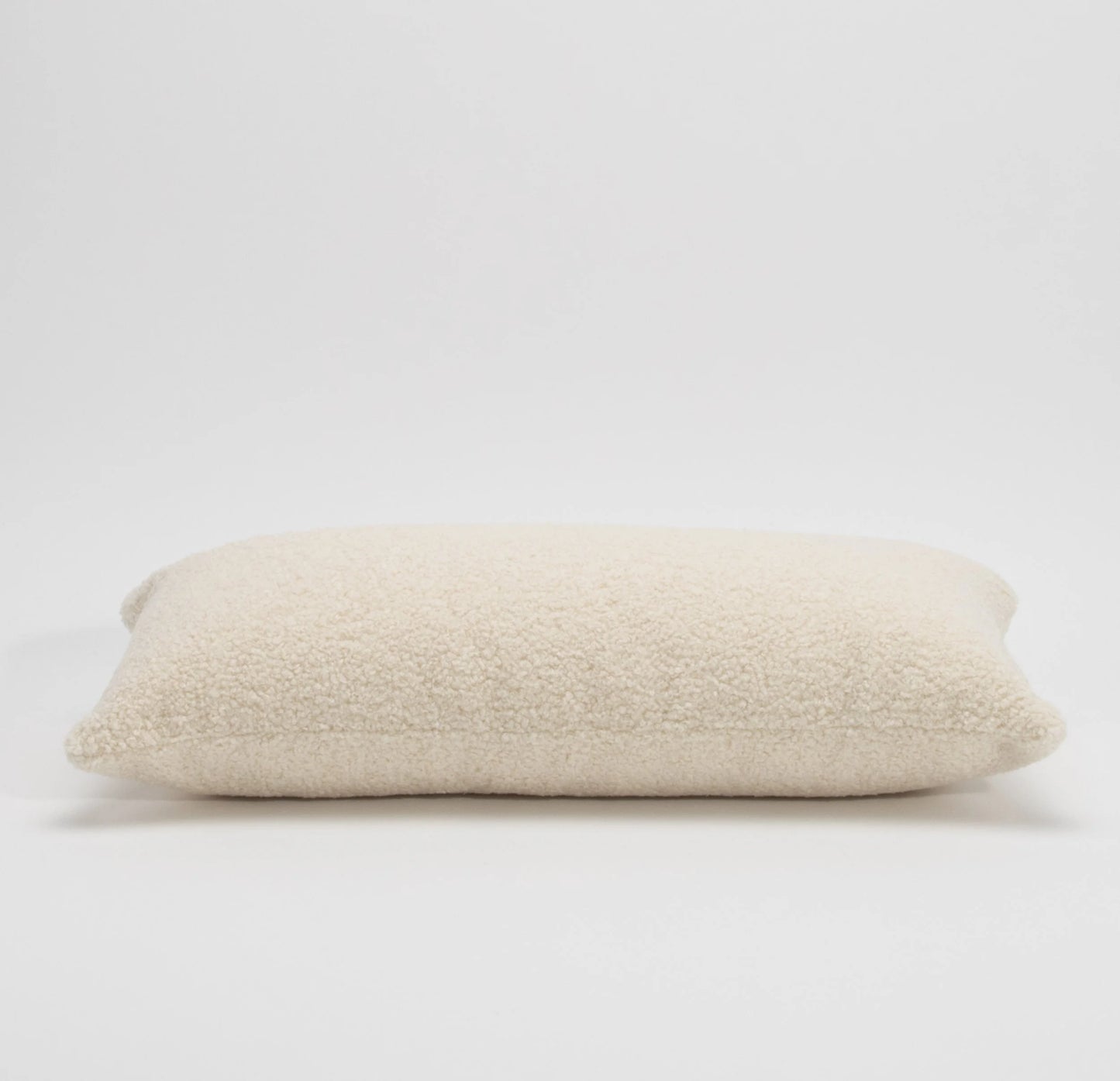 Cream Textured Kidney Pillow By MOGUL